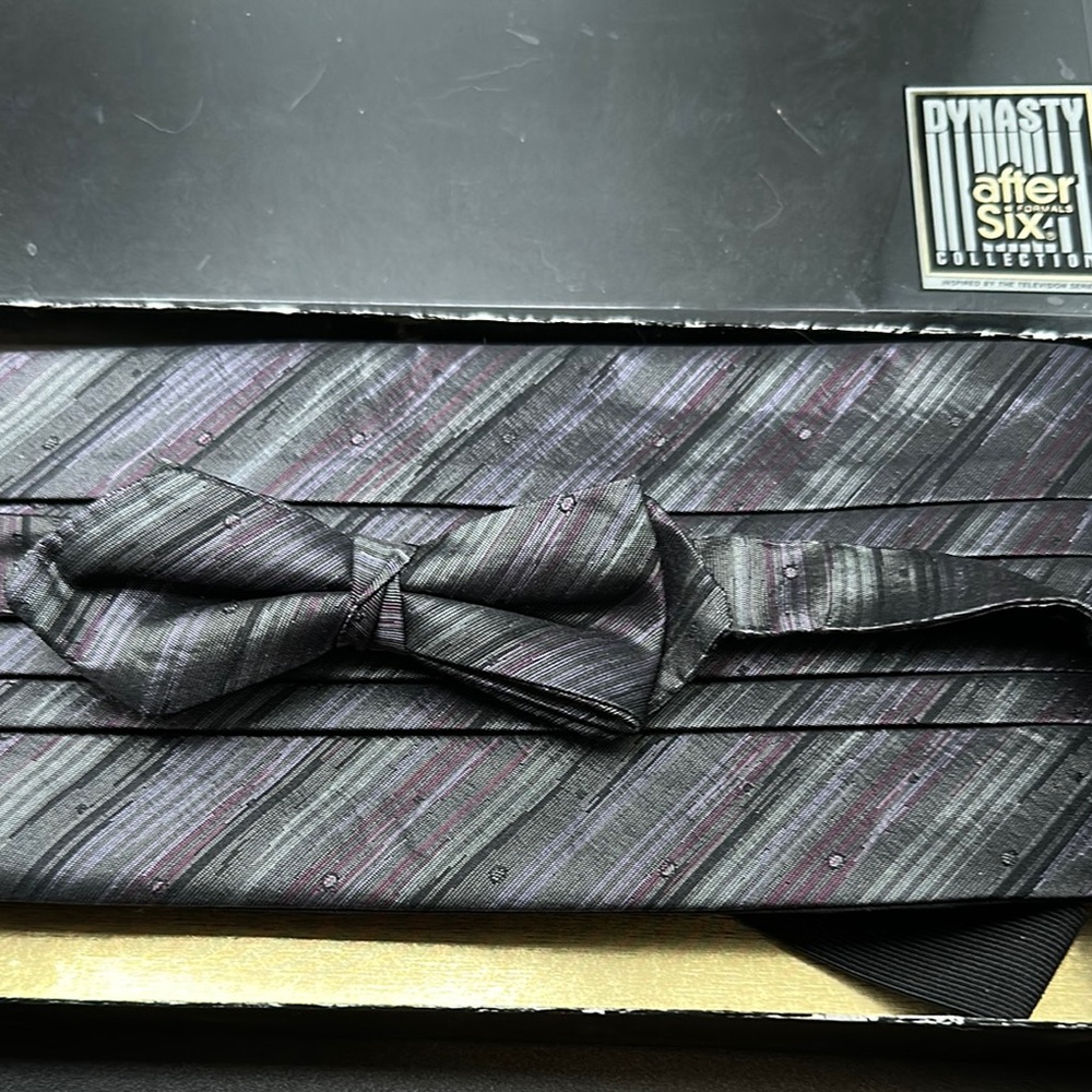 A cummerbund and matching tie set After Six Black and Gray Silk